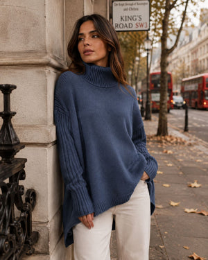 Woman in a blue oversized turtleneck on a London street — Hollis Morgan